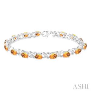 7x5 mm Oval Cut Citrine and 1/20 Ctw Round Cut Diamond Fashion Bracelet in Sterling Silver