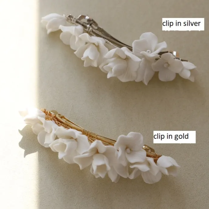 C199. clay flower hair clip, available in gold and silver