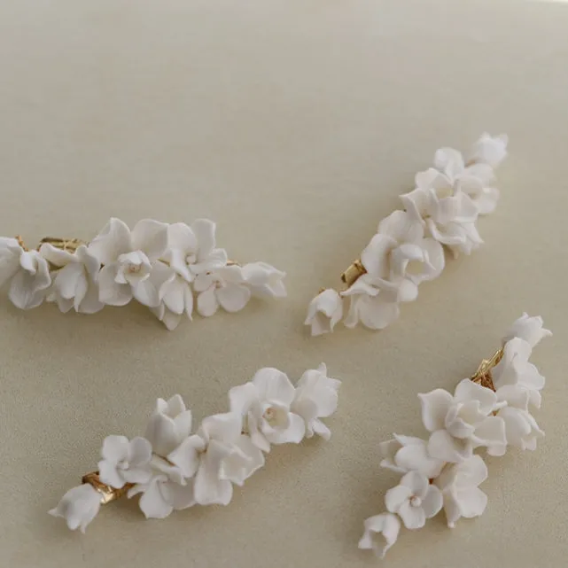 C199. clay flower hair clip, available in gold and silver