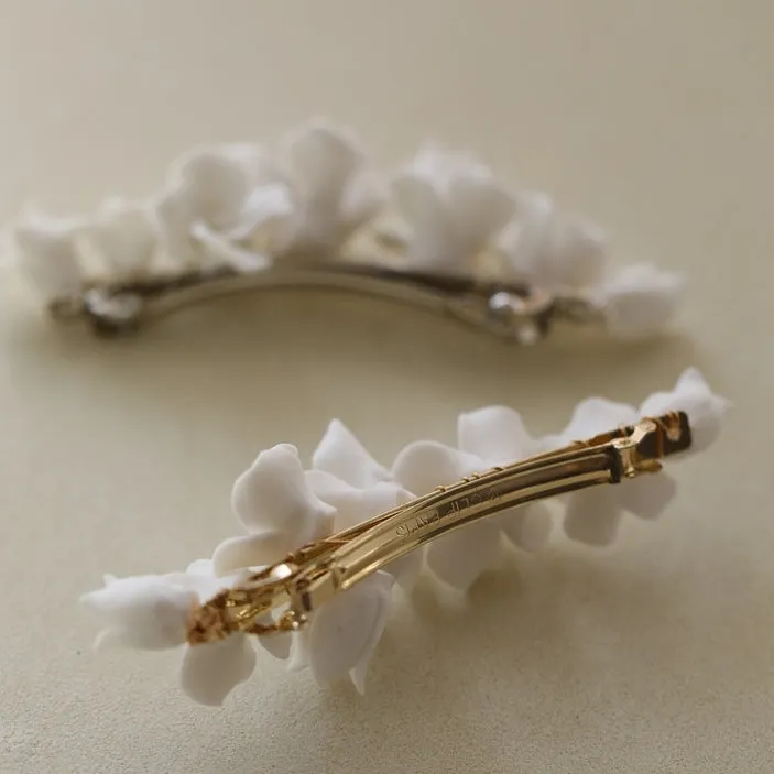 C199. clay flower hair clip, available in gold and silver