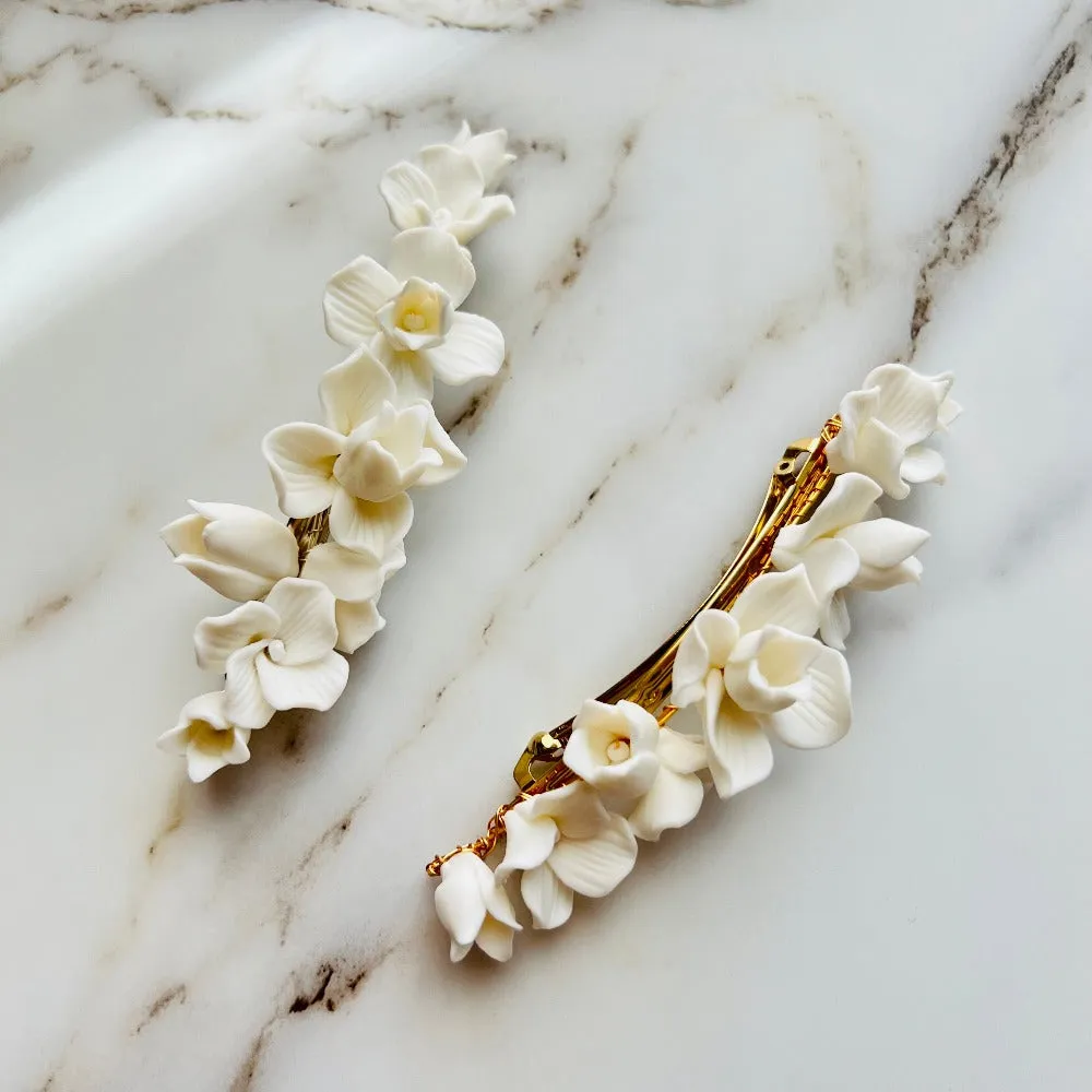 C199. clay flower hair clip, available in gold and silver