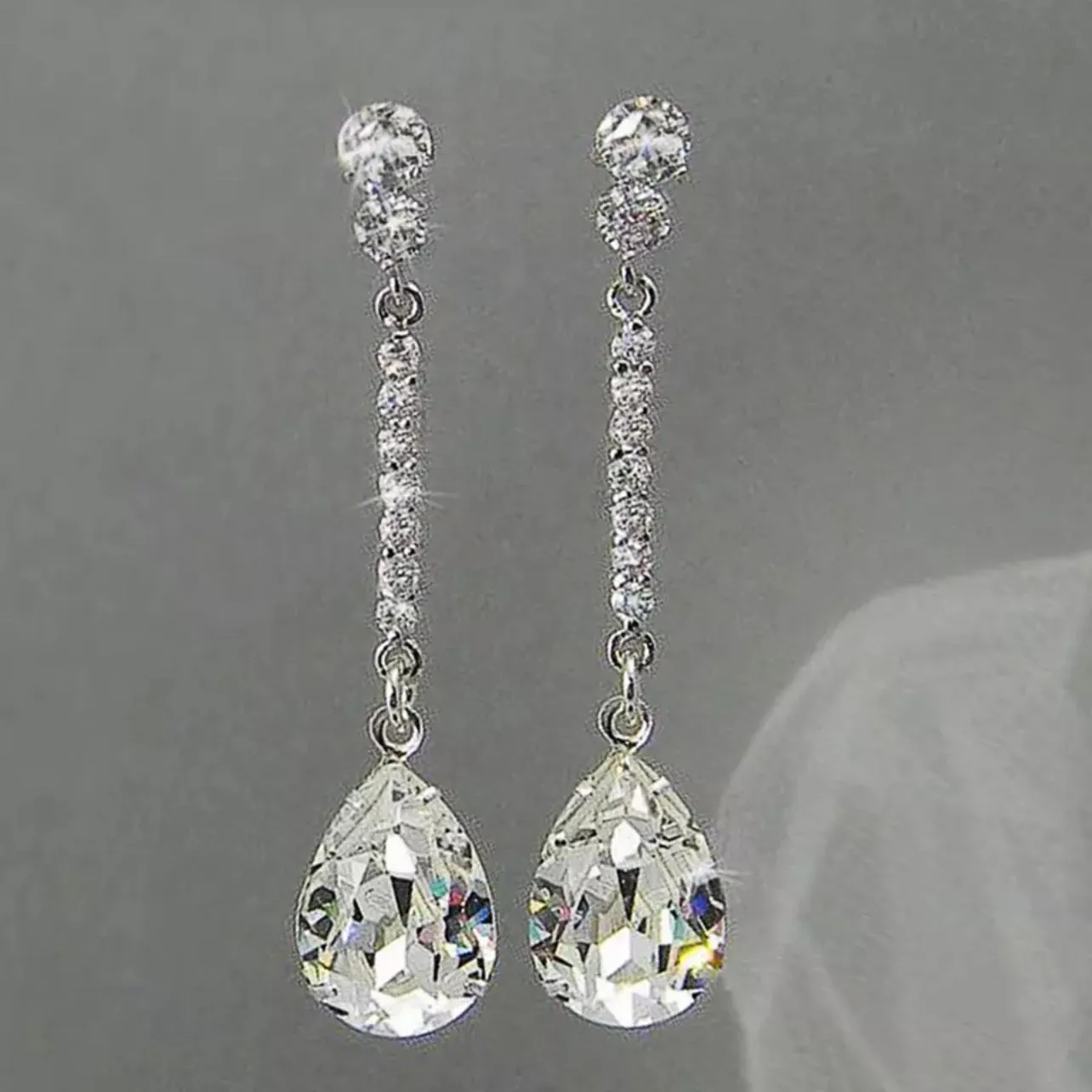 Luxury Long Silver Dangle Drop Earrings with Pear Cubic Zircon Main Stone.